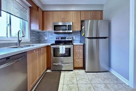 Kitchen or kitchenette, dishwasher, oven, stove, toaster