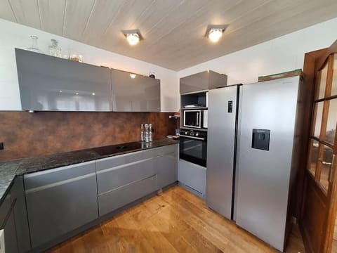 Kitchen or kitchenette, dishwasher, oven, stove