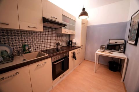 Kitchen or kitchenette, oven, stove, toaster