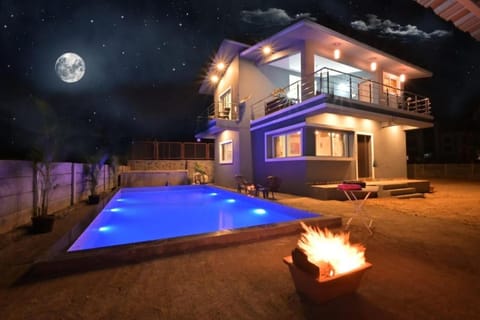 Property building, Patio, Night, Natural landscape, Pool view, Swimming pool, sunbed