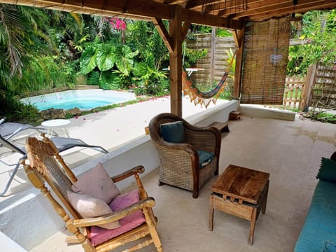 Patio, Balcony/Terrace, Living room, Seating area, Garden view, Pool view, Swimming pool, sunbed