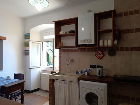 Kitchen or kitchenette, stove, washing machine