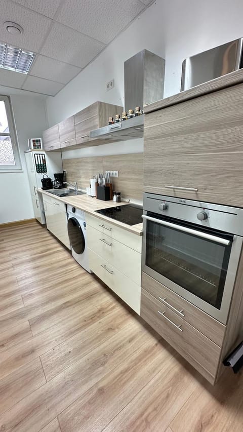 Kitchen or kitchenette, dishwasher, oven, stove, toaster, washing machine, dryer