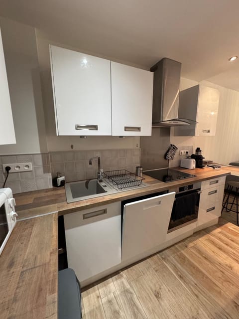 Kitchen or kitchenette, dishwasher, oven, stove, toaster