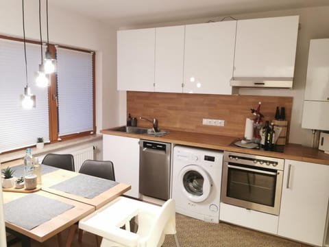 Kitchen or kitchenette, Dining area, dishwasher, oven, stove, washing machine