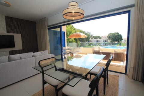 Living room, Seating area, Pool view