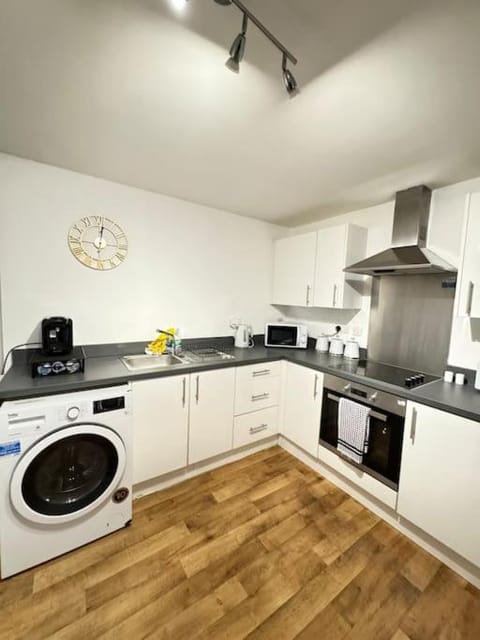 Kitchen or kitchenette, dishwasher, oven, stove, toaster, washing machine, dryer