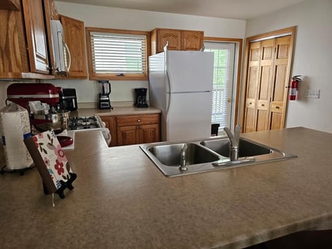 Kitchen or kitchenette, dishwasher, oven, stove