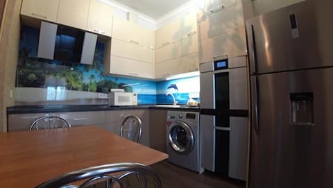 Kitchen or kitchenette, Dining area, dishwasher, oven, stove, washing machine