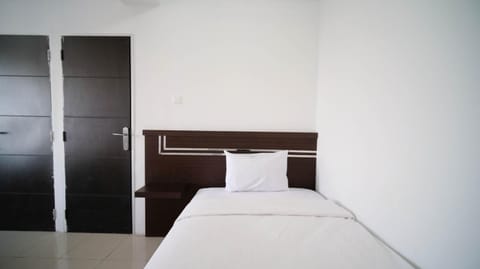 Simple 2BR with Extra Bed at Menara Rungkut Apartment By Travelio Apartment in Surabaya