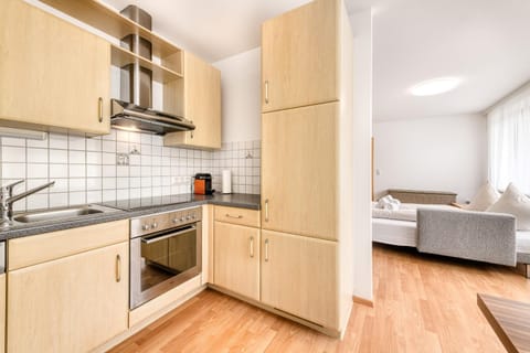 Kitchen or kitchenette, dishwasher, oven, stove