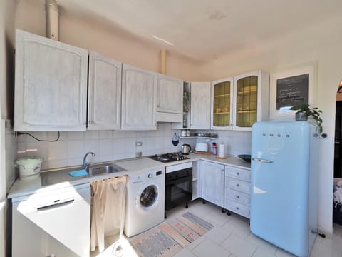 Kitchen or kitchenette, dishwasher, stove, washing machine