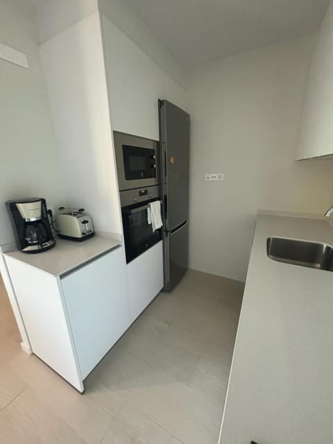 Kitchen or kitchenette, oven, stove