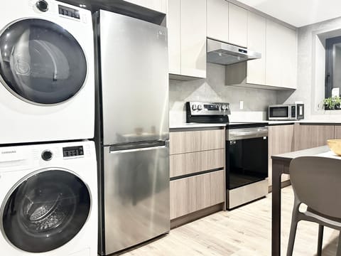 Kitchen or kitchenette, dishwasher, stove, washing machine, dryer