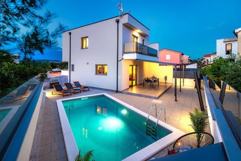 Property building, Patio, Night, Pool view, Swimming pool, sunbed