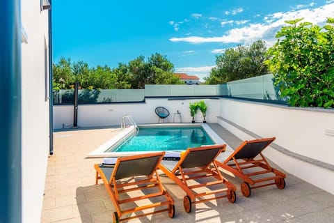 Patio, Pool view, Swimming pool, sunbed