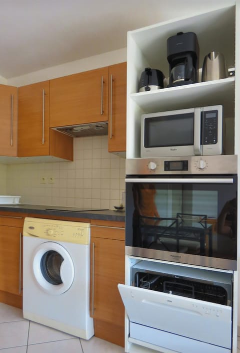 Kitchen or kitchenette, dishwasher, oven, stove, washing machine