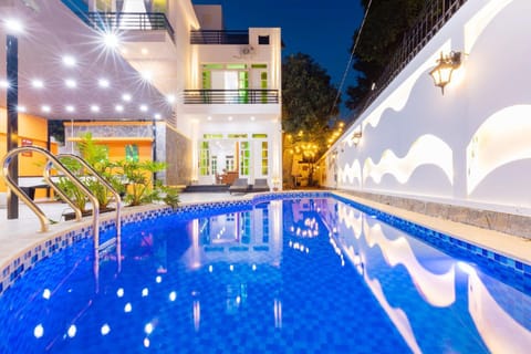 Property building, Patio, Night, Pool view, Swimming pool, sunbed