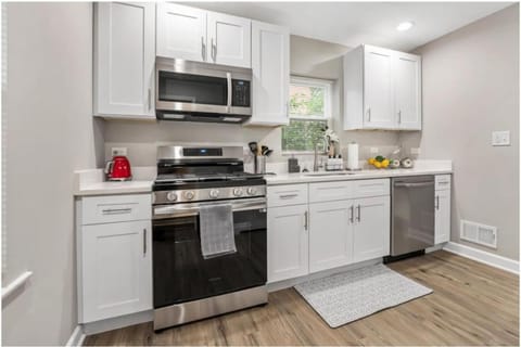 Kitchen or kitchenette, dishwasher, oven, stove