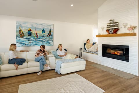 People, Living room, Seating area, group of guests, fireplace