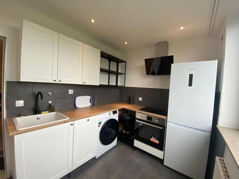 Kitchen or kitchenette, dishwasher, oven, stove, toaster