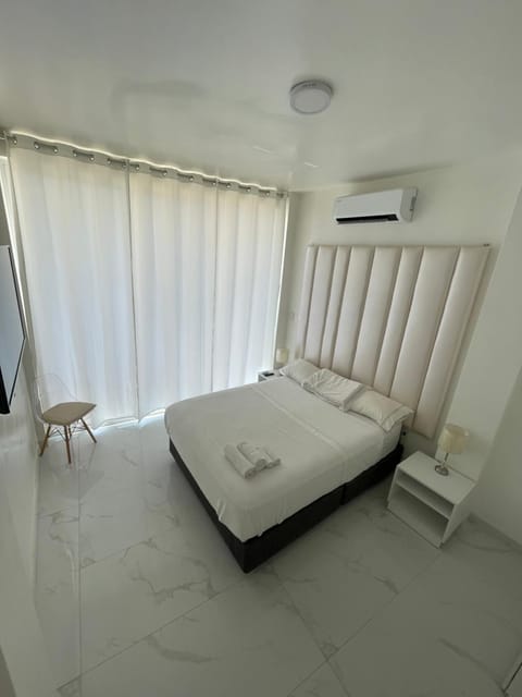 Bed, Photo of the whole room, Bedroom, towels, air conditioner