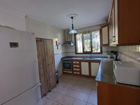 Kitchen or kitchenette, dishwasher, oven, stove