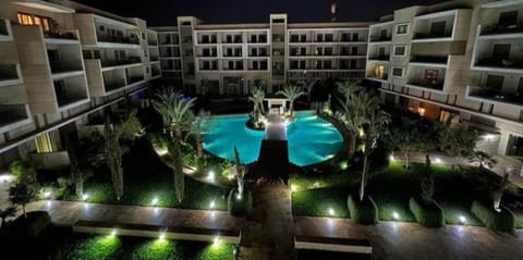 Property building, Patio, Night, Pool view, Swimming pool