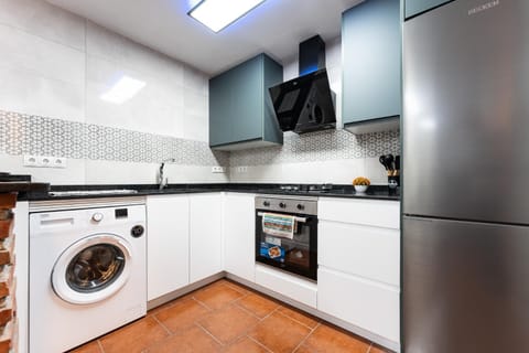 Kitchen or kitchenette, oven, stove, washing machine