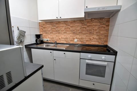 Kitchen or kitchenette, oven, stove