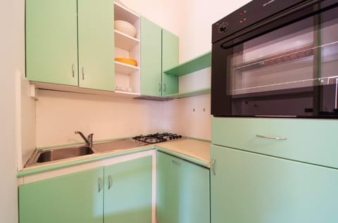 Kitchen or kitchenette, oven, stove
