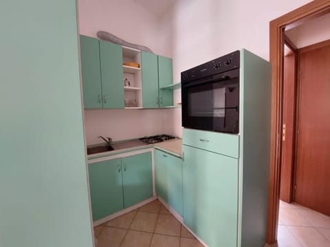 Kitchen or kitchenette, oven, stove