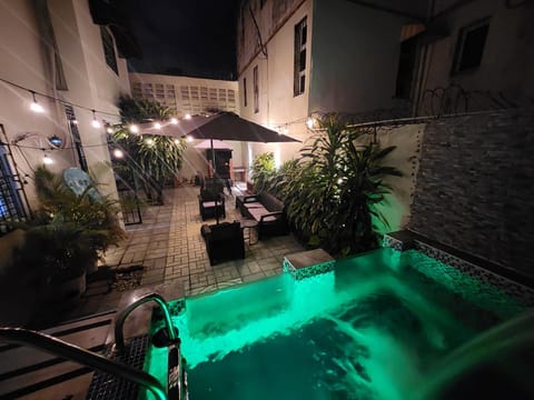 Property building, Night, Natural landscape, Pool view, Swimming pool, Swimming pool, sunbed