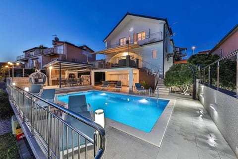 Property building, Patio, Night, Pool view, Swimming pool, sunbed