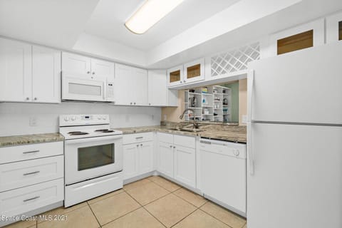 Kitchen or kitchenette, dishwasher, oven, stove