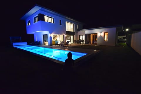 Night, Pool view, Swimming pool, group of guests, sunbed