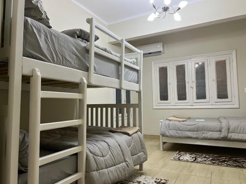 Bed, Photo of the whole room, Bedroom, bunk bed, air conditioner