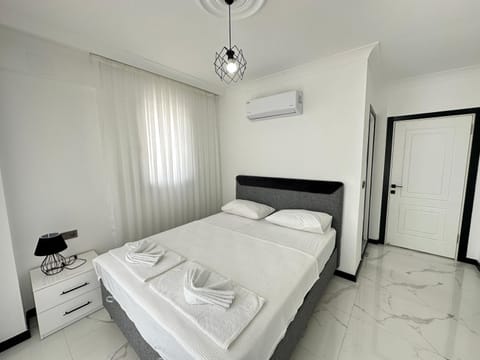 Bed, Photo of the whole room, Bedroom, towels, air conditioner