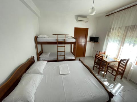 Property building, Communal lounge/ TV room, Bed, Photo of the whole room, bunk bed, air conditioner