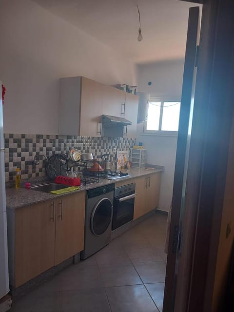 Kitchen or kitchenette, stove, washing machine