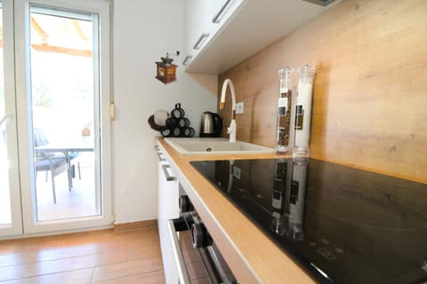 Kitchen or kitchenette, dishwasher, oven, stove