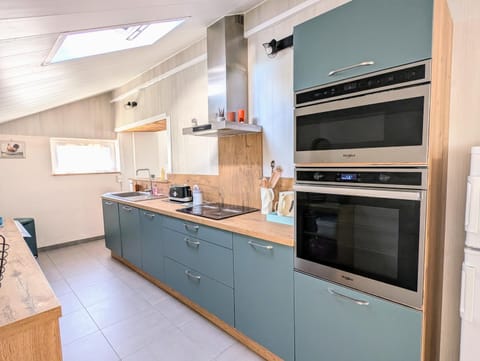 Kitchen or kitchenette, dishwasher, oven, stove