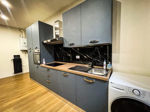 Kitchen or kitchenette, dishwasher, oven, washing machine, dryer