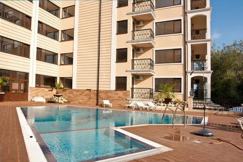 Property building, Patio, Pool view, sunbed