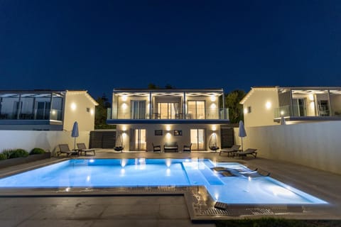 Property building, Patio, Night, Balcony/Terrace, Pool view, Swimming pool, sunbed