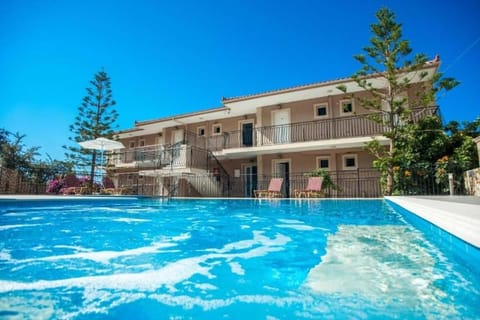 Property building, Pool view, Swimming pool, sunbed