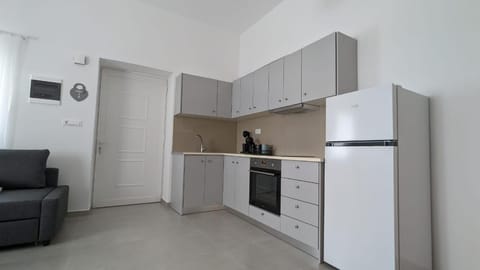 Kitchen or kitchenette, oven, stove, toaster, washing machine