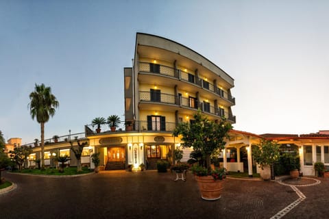 Property building, Restaurant/places to eat, Facade/entrance, Property logo or sign, Bird's eye view, View (from property/room), Autumn, On site, Garden view, Time of day, Sunset