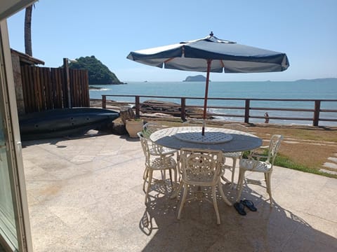 Patio, Natural landscape, Dining area, Beach, Sea view