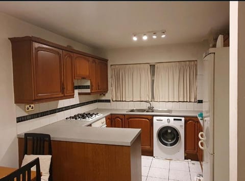 Kitchen or kitchenette, dishwasher, stove, washing machine